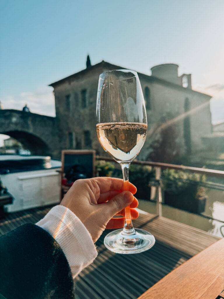 Arm holding champagne flute